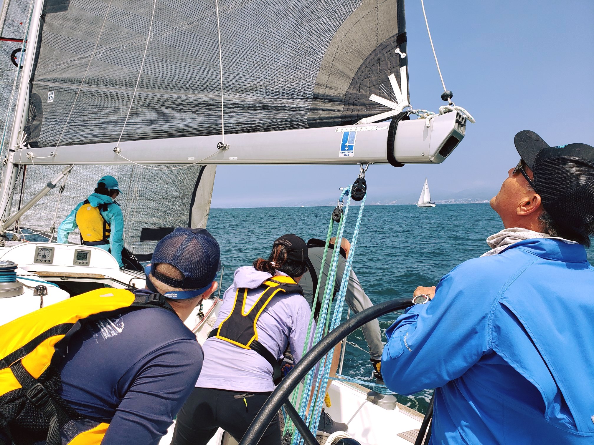 Small crew sailing on a boat