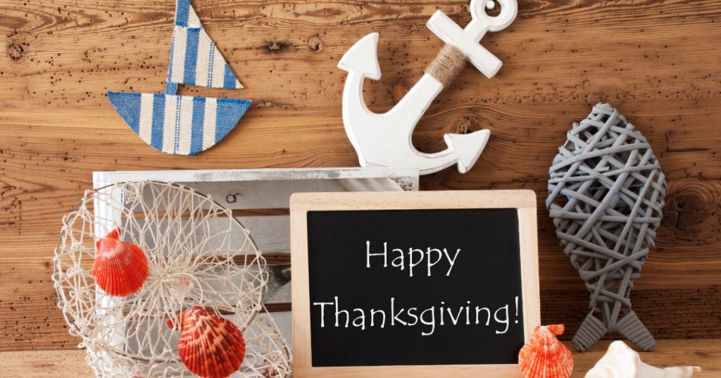 pumpkins and thanksgiving sign with anchor and nautical decorations