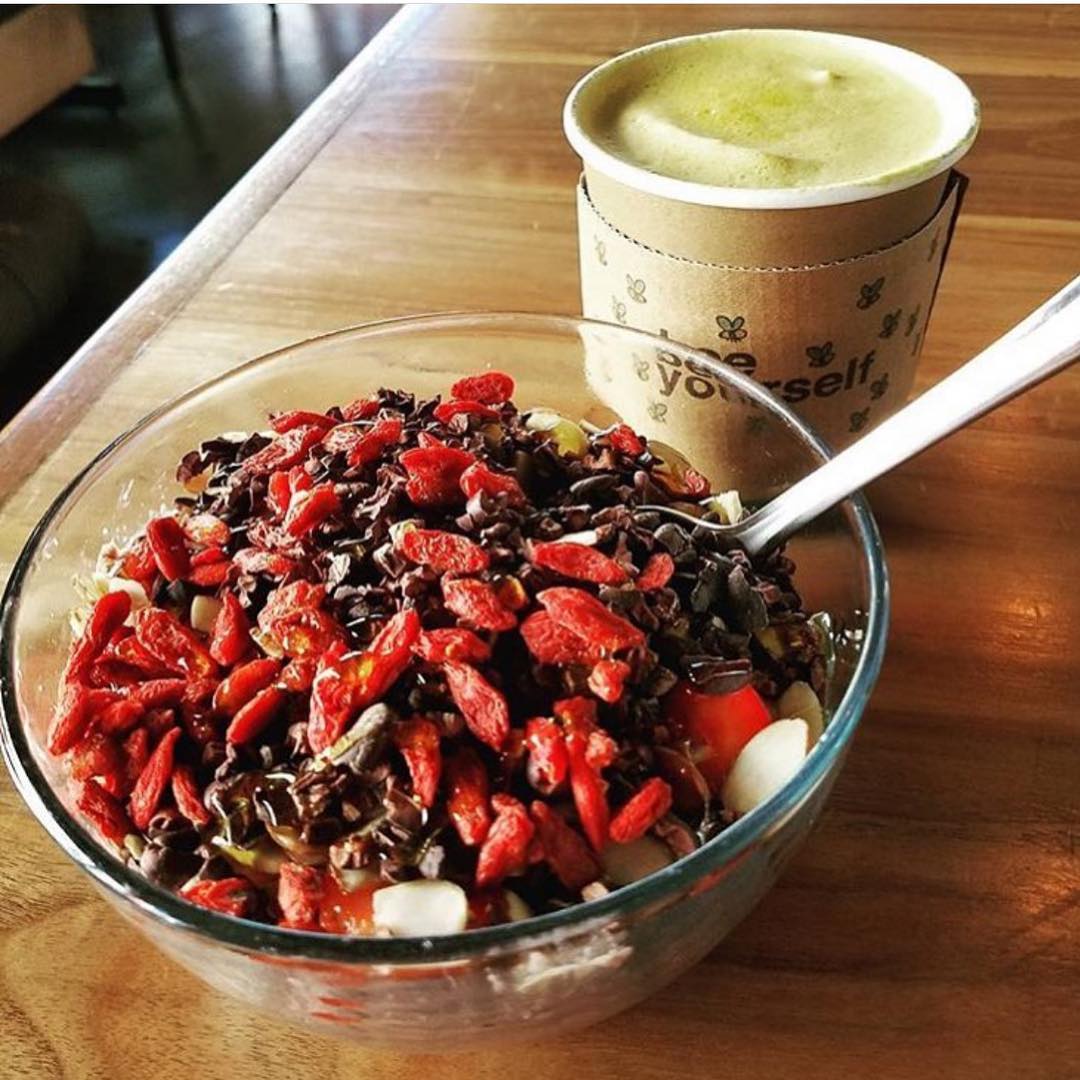 acai bowl with fruit and coffee