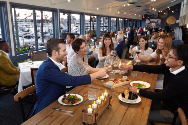 People lifting glasses in one of the Marina del Rey Restaurant